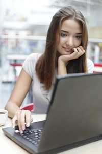 Girl on a laptop writing her CV